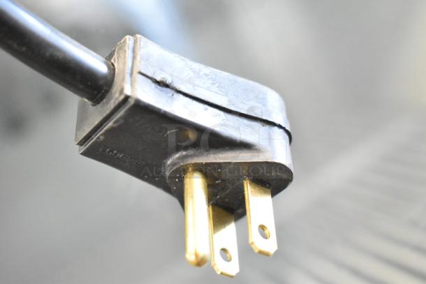 Close-up of a Habco SE12 cooler's electrical plug, showing standard 115V, 1 phase power compatibility.