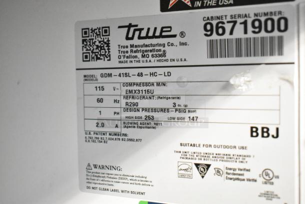 Label of a 2019 True GDM-41SL-48-HC-LD commercial cooler showing model, voltage, refrigerant type R290, and specifications.
