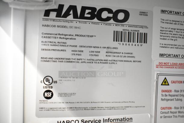 Label inside a Habco SE18HC commercial cooler, detailing model, electrical rating, and safety instructions. UL and NSF listed.