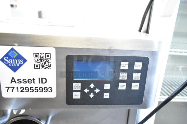 Stoelting stainless steel soft serve ice cream machine with drink mixing attachment, control panel shown. Sam’s Club asset ID visible.