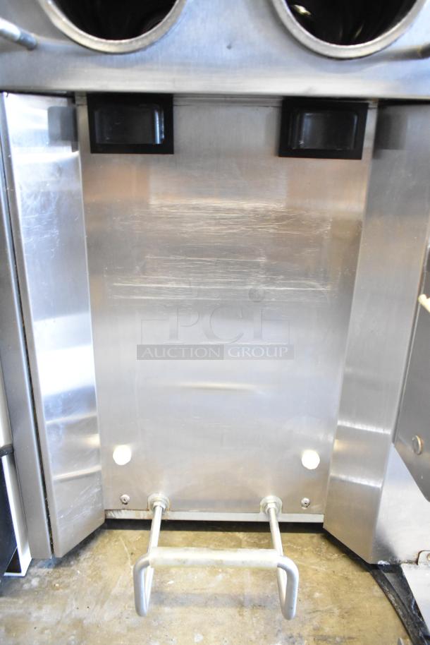 Stoelting stainless steel soft serve ice cream machine with drink mixing attachment, countertop model, commercial use.