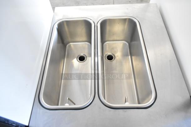 Stoelting stainless steel commercial countertop soft serve ice cream machine with drink mixing attachment, dual bins.
