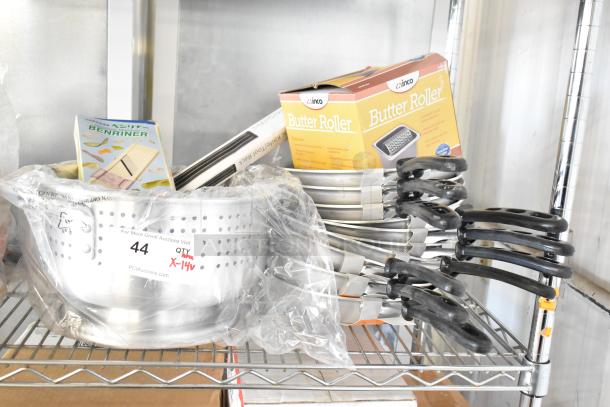 Brand new kitchen items including an 18" magnetic knife rack, Winco ALO-8BH colander, Winco SPBR-604 butter roller, and Vollrath 67810 skillets. Quantity of 14 scratch and dent items on auction.