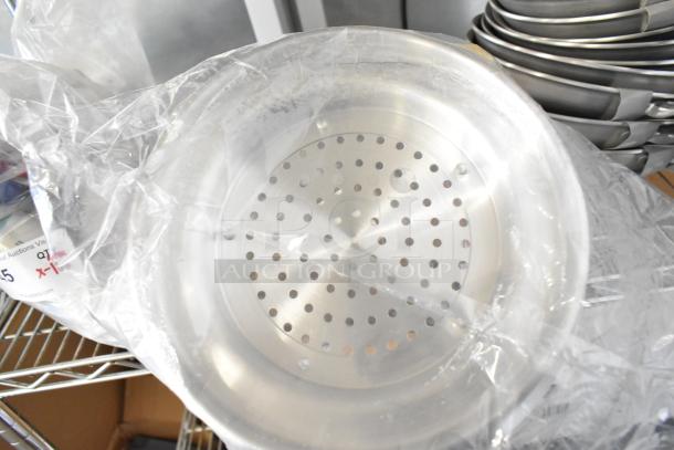 14 new scratch and dent kitchen items, including Winco ALO-8BH colander, wrapped in plastic with visible auction label.