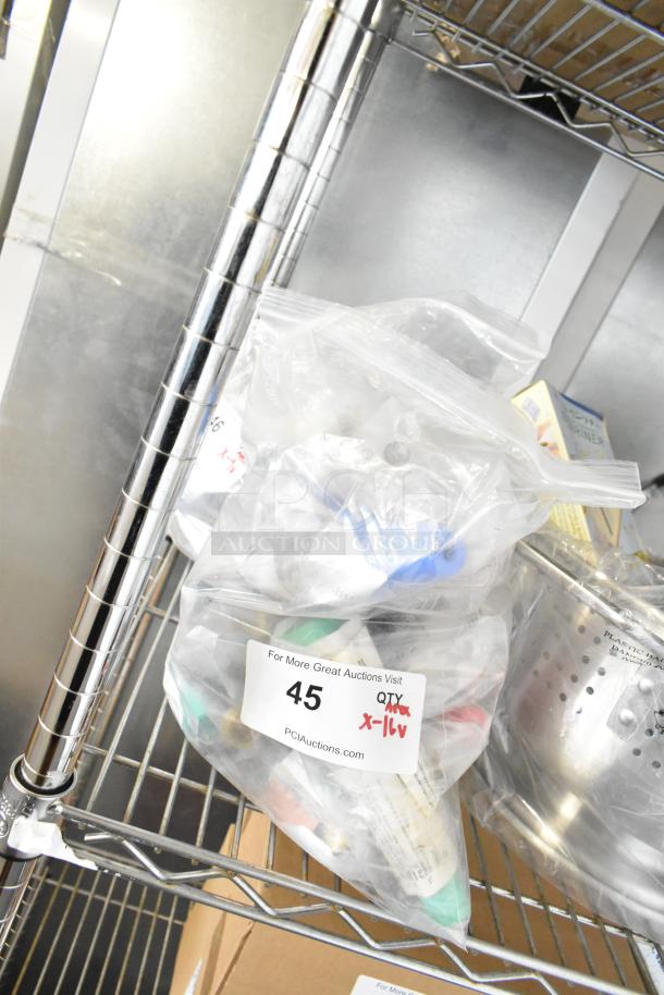 Bag of 16 brand new Marinco items, including connectors and protective caps. Labeled with auction info and quantity.