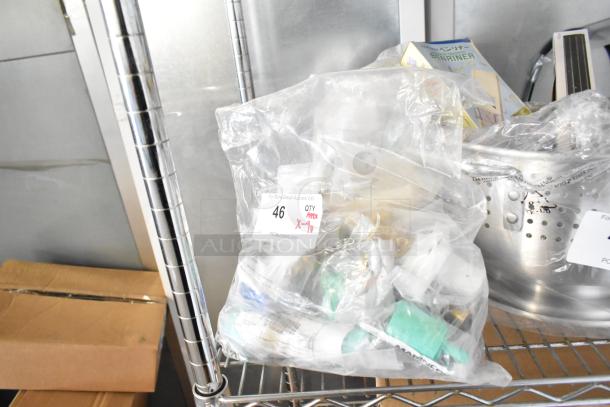 Bag of nine Marinco electrical components including protective caps, panel mounts, and connectors. New, scratch and dent condition.