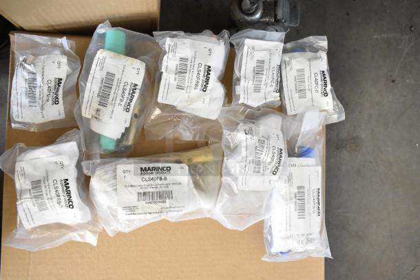 Nine Marinco electrical components, new with scratch and dent, including protective caps, panel mounts, and connectors labeled in bags.