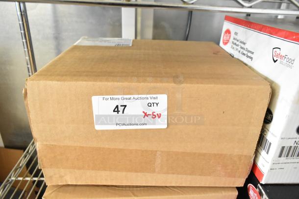 Cardboard box with label "47 QTY x-5" indicating scratch and dent auction lot; includes Carlisle food pan, cleaning duo, TableCraft bottle.