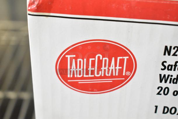 Close-up of TableCraft packaging with logo and text indicating N20C WideMouth Squeeze Bottles. Boxes show slight dents.