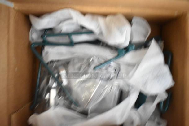 Box containing 18 new scratch and dent items, including brushes and poly bins, wrapped in paper. Ideal for resale or use.