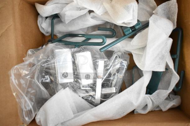 Box of 18 brand new scratch and dent items including metal hooks and poly bins, wrapped in protective tissue.