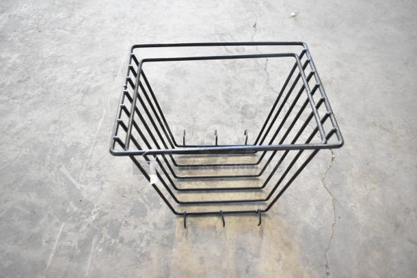 Set of black metal storage bins, new scratch and dent condition, suitable for organizing or display. Tags indicate item condition.