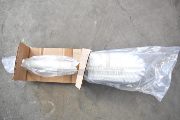 Cardboard box containing new brushes in plastic wrap, part of a lot of 18 scratch and dent items including brushes and poly bins.