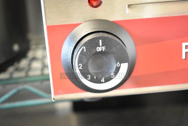 Close-up of the control dial on a brand-new Avantco 177W50 stainless steel electric countertop food warmer.