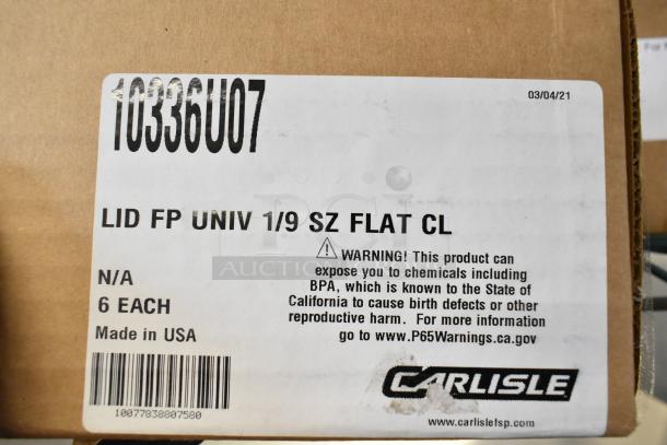 Carlisle 10336U07 StorPlus polycarbonate flat universal lid box, labeled "LID FP UNIV 1/9 SZ FLAT CL," with safety warning. Made in USA.