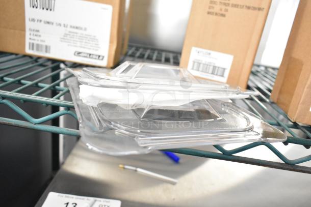 12 new items including Carlisle StorPlus polycarbonate lids and Taylor thermometer, in original boxes.