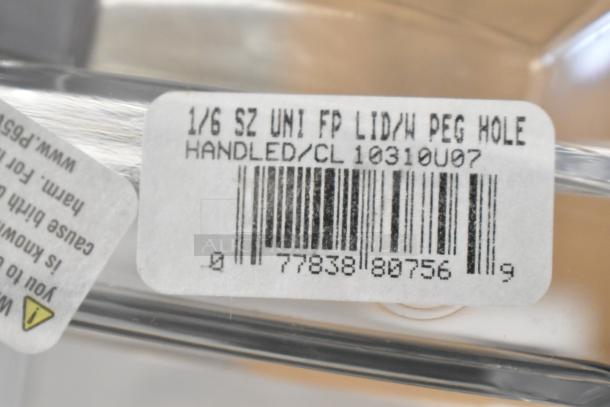 Close-up of label on brand new Carlisle 10310U07 Universal 1/6 Size Food Pan Solid Lid, shows barcode and product details.