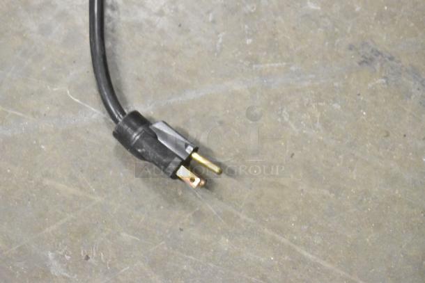 2021 H&K 52473-1 commercial French fry freezer plug, black cord, on concrete floor. 115V, 1 phase.