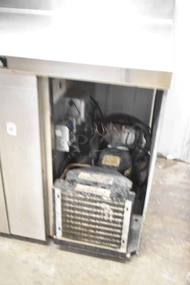 Delfield 18WC39R commercial work top cooler with backsplash. Single door, visible interior components, 115 volts, 1 phase.