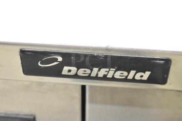 Delfield 18WC39R commercial work top cooler, single door, with backsplash shown, 115 volts, 1 phase, visible brand logo.