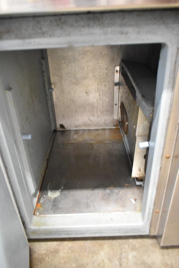 Delfield 18WC39R Single Door Work Top Cooler interior, visible wear and discoloration, 115 Volts, 1 Phase.