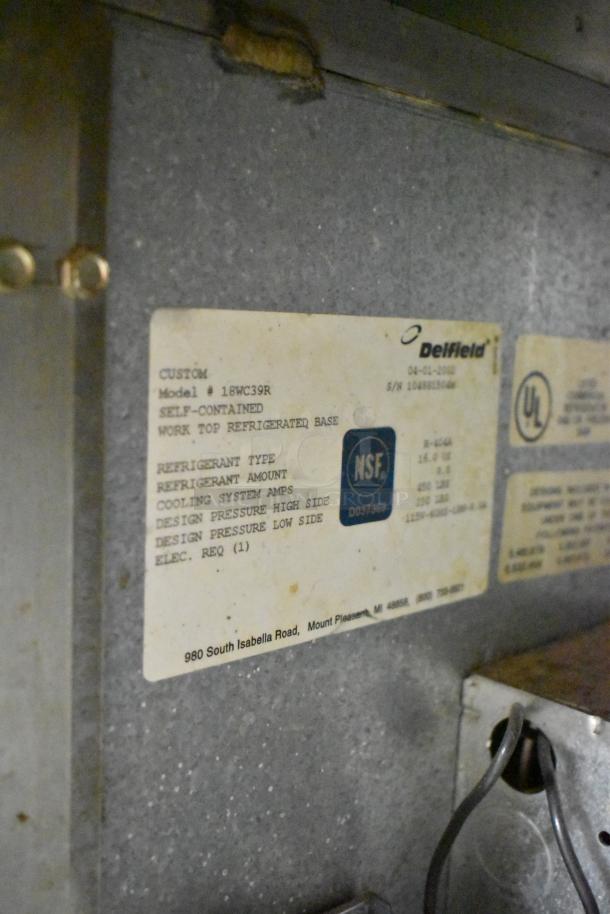 Delfield 18WC39R Commercial Cooler label showing model details and specifications. 115 volts, 1 phase, NSF certified.