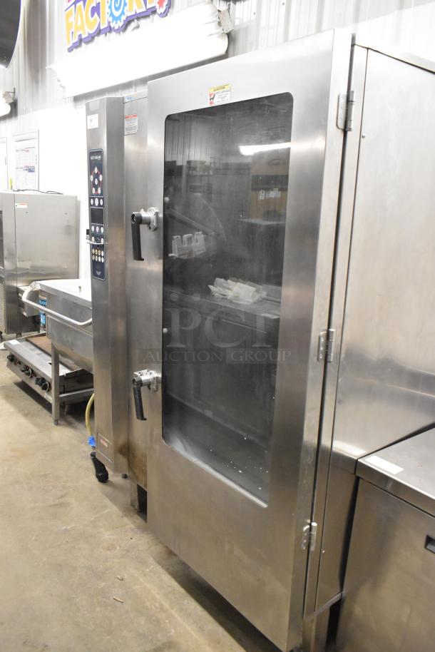 Alto Shaam stainless steel commercial combi convection oven with probe. Features control panel, dual handles. Excellent condition.