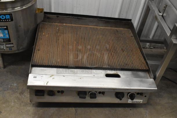 Garland Commercial Countertop Gas Charbroiler, stainless steel, ribbed grill surface, control knobs, used condition.
