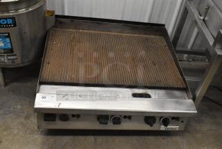 Garland Commercial Countertop Gas Charbroiler, stainless steel, ribbed grill surface, control knobs, used condition.