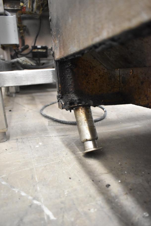Garland Commercial Countertop Gas Charbroiler leg detail, shows metal build and used condition. Ideal for restaurant use.