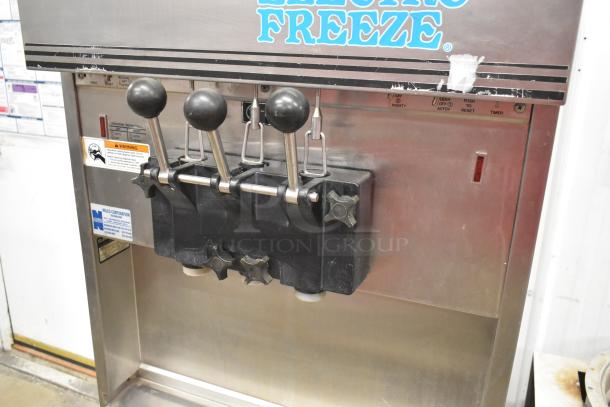 Electro Freeze 56TF-232 commercial soft serve machine, 2 flavor with twist, on casters, 208-230V, 3 phase, visible controls, good condition.