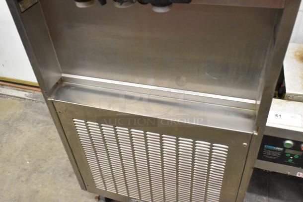Electro Freeze 56TF-232 commercial 2-flavor soft serve machine on casters, 208-230V, 3-phase, good condition, stainless steel.