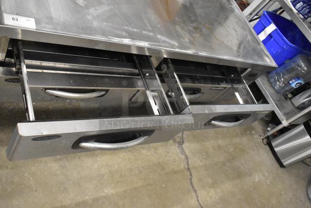 Norlake commercial chef base with 4 drawers, stainless steel, on casters. Features Norlake branding, 115 volts, 1 phase.
