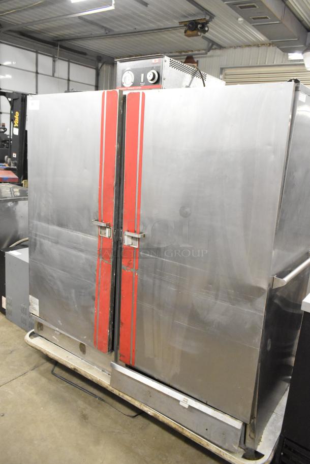 Carter Hoffmann BB1000 metal heated holding cabinet on casters, dual doors, red accents, 120V, 1 Phase, good condition.