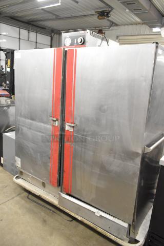 Carter Hoffmann BB1000 metal heated holding cabinet on casters, dual doors, red accents, 120V, 1 Phase, good condition.