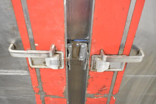 Carter Hoffmann BB1000 heated holding cabinet, metal with red details, dual handles, on commercial casters, 120V, 1 phase.