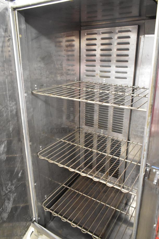 Carter Hoffmann BB1000 heated holding cabinet, metal, commercial casters, three wire shelves, 120V, 1 Phase.
