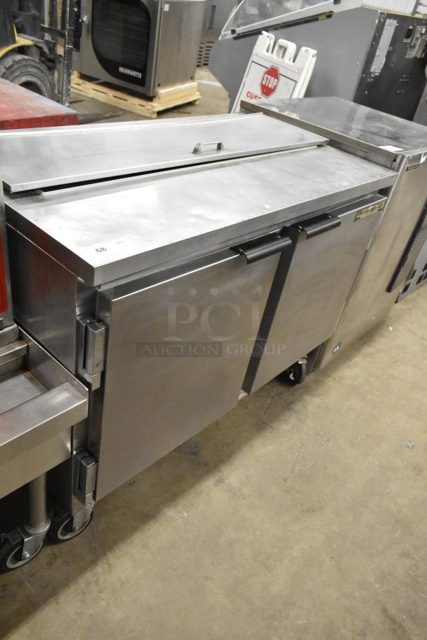 Beverage Air SUR48-12 commercial prep table on casters, stainless steel, 115 volts, 1 phase, dual doors, label intact.