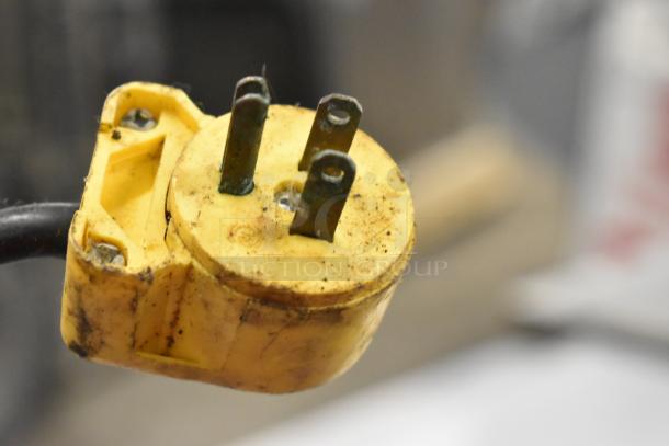 Yellow electrical plug for a Beverage Air SUR48-12 prep table, showing visible rust and wear.