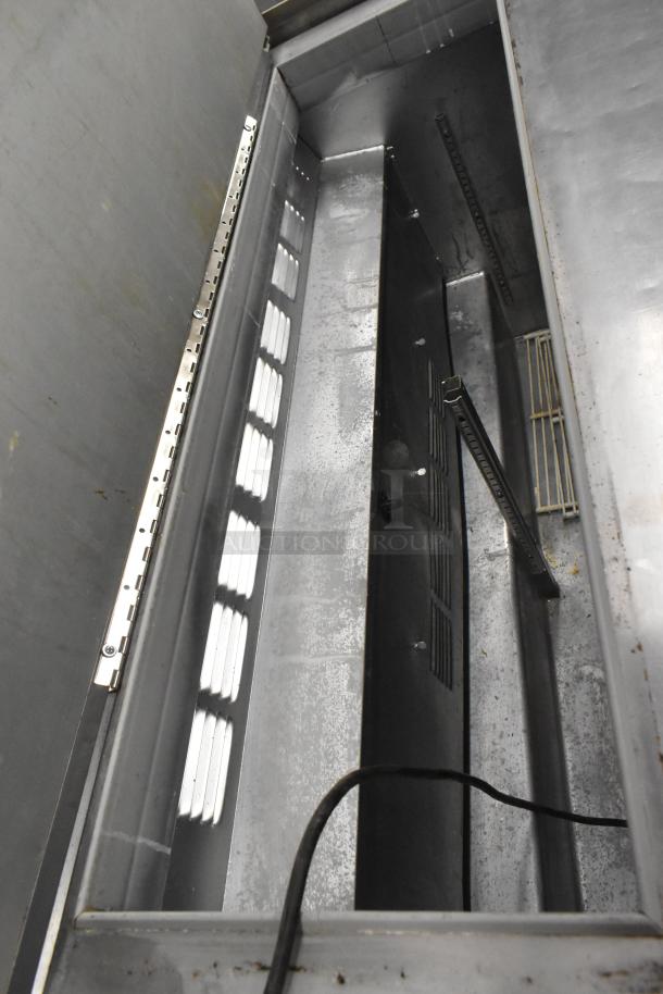 Beverage Air SUR48-12 commercial prep table interior view, showing stainless steel compartments and ventilation features.