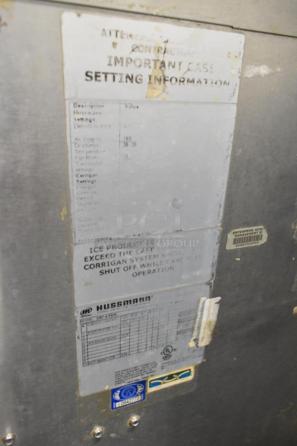 Hussmann DSF-4-REM commercial fish case with visible setting information and asset management ID tag.