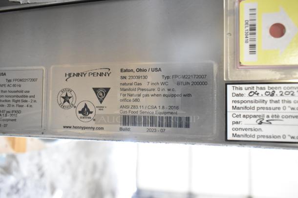 2023 Henny Penny FPGM22172007 stainless steel gas convection oven label. Model and specs visible. 200,000 BTU.