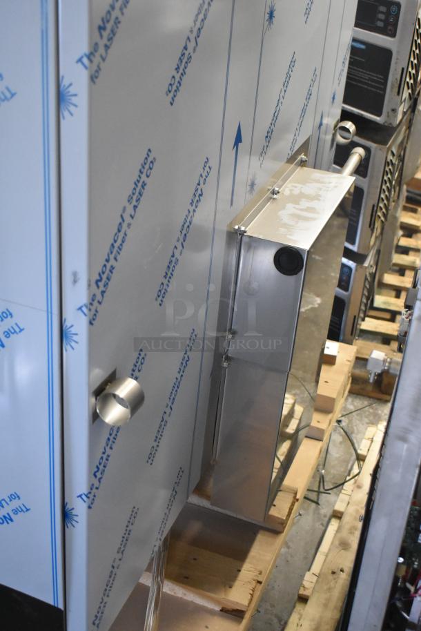 Brand new Henny Penny FPGM22172007 stainless steel gas combi convection oven, 200,000 BTU, with pan transport rack.