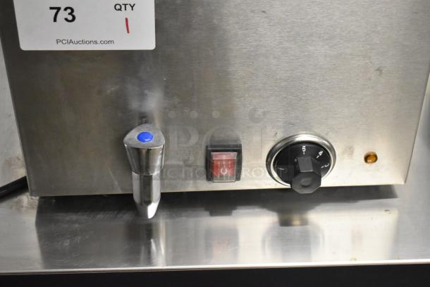 KoolMore CFW-4T countertop food warmer, brand new with scratches and dents. Features 110V, 1 Phase. Auction tag visible.
