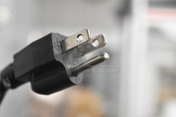 Close-up of a power plug for the KoolMore CFW-4T Countertop Food Warmer, 110 Volts, 1 Phase.
