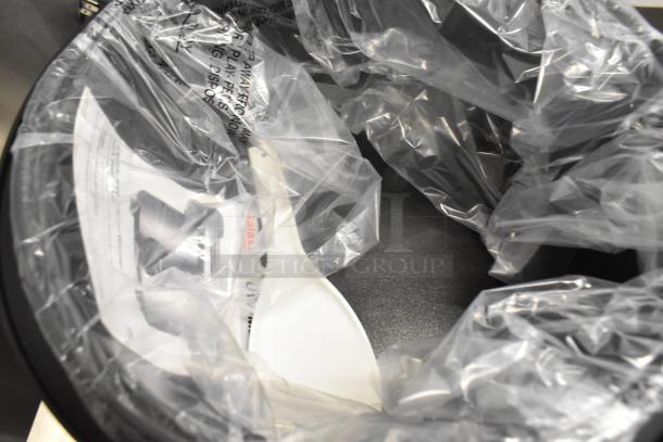 Brand new Galaxy 177GRCS60 60-cup electric rice cooker, packaged with protective plastic. Model visible, includes instructions.