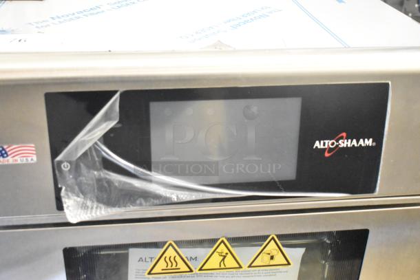 Brand new 2022 Alto Shaam CTX4-10E stainless steel combi oven, boilerless, with digital display and safety warnings, 380-415V, 3 phase.