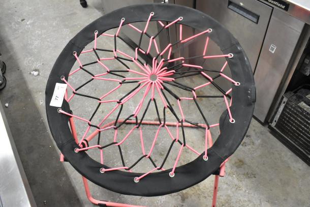 Folding Net Chair with pink and black net design, metal frame, and circular seat. Price tag attached, item number 77.