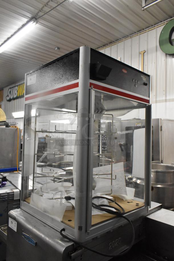 Hatco FSDT-2 Flav-R-Savor display cabinet with four-tier circle rack, two doors, 120V, 1 phase, in used condition.