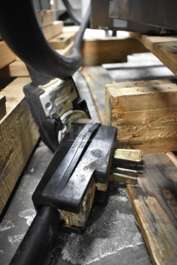 Close-up of a power cable and plug for a Turbochef HhC2020 conveyor oven, showing 3-phase, 208/240V connection.